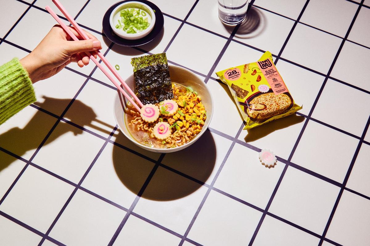 A styled bowl of immi Black Garlic Chicken
